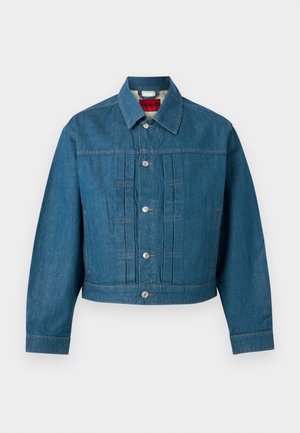 Sinine teksatagi pikkade varrukatega, nööpidega kinnituv, kraega ja kaela siseküljel nähtava brändimärgiga.