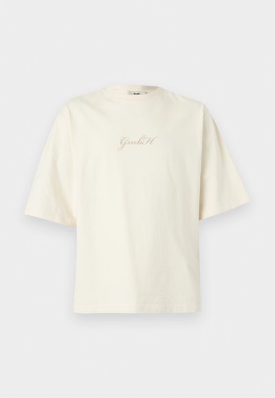 Εκρού oversized κοντομάνικο μπλουζάκι με στρογγυλή λαιμόκοψη και το λογότυπο "GmbH" στο κέντρο του στήθους.