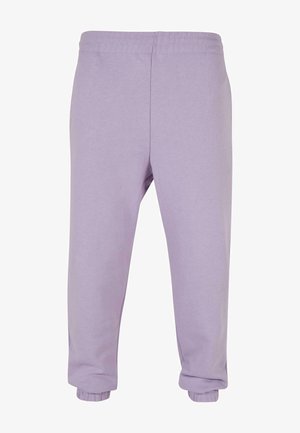 Lilla dressipüksid, mis on valmistatud pehmest puuvillast, on varustatud elastse vöökohtadega ja soonik-elastikuga põlvedes, mugava lõikega ja ilma nähtavate mustriteta.