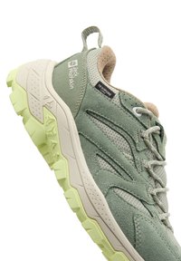 Light green hiking shoe with a suede and mesh upper, textured rubber outsole, and minimal branding. Features a pull tab for easy wear.