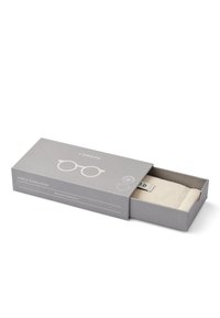 Gray rectangular box with a lid, containing light beige sunglasses pouch. Box features a simple sunglasses graphic and brand name.