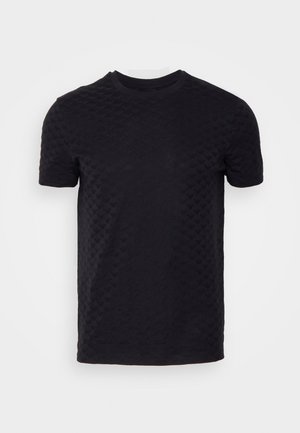 Black short-sleeve t-shirt with textured pattern resembling small hearts. Round neckline and standard fit. Crafted from soft fabric.