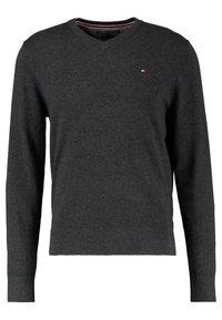 Tumma harmaa v-aukkoinen neulepaita pitkähihaisilla hihoilla. Valmistettu pehmeästä kankaasta, jossa on ribbaus hihansuissa ja helman reunassa, sekä pieni logo vasemmassa rinnassa.