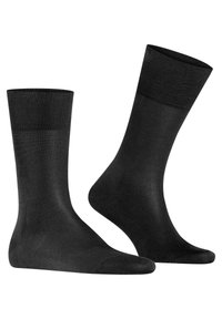 Sorte sokker lavet af glat materiale, med ribbet kant, sømløse tæer og et klassisk crew-længde design.