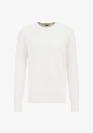 Bela pletena jopica s krojem na vratu, dolgimi rokavi, rebrastimi manšetami in robom, ki ima teksturiran vzorec. Diskretna blagovna znamka na strani.