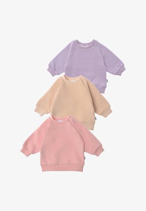Three cotton sweatshirts displayed together: lavender, beige, and pink. Each has a round neck, raglan sleeves, and ribbed cuffs.