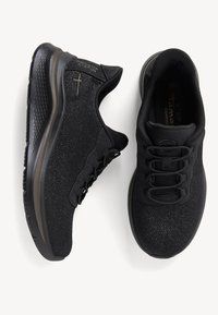 Scarpe da ginnastica nere con tomaia in maglia testurizzata, lacci elastici, suola imbottita, dal design elegante e snello con accenti minimi.
