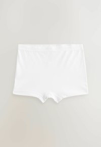 Shorts en coton blanc avec une taille élastique douce. Présente une texture lisse et une coupe classique. Aucune motif ou accent visible.