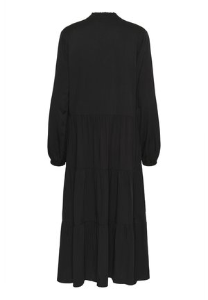 Robe noire longue à volants avec manches longues et poignets élastiques froncés, vue de dos sur fond blanc.