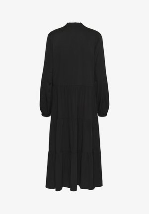 Pikk must kihiline kleit, millel on pikad varrukad ja kogutud elastsed mansetid, nähtud tagantvalgel taustal.