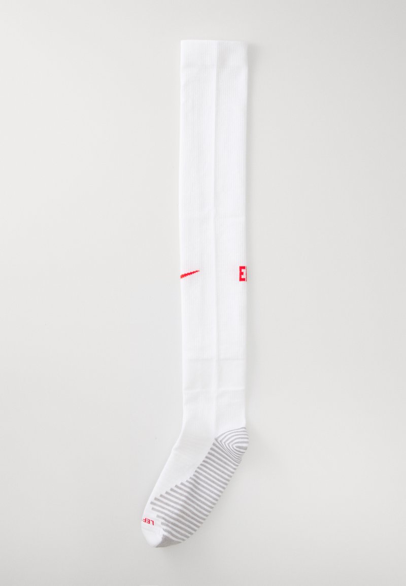 White knee-high sock with ribbed texture, featuring a red logo and a striped gray pattern on the foot area. Soft fabric material.