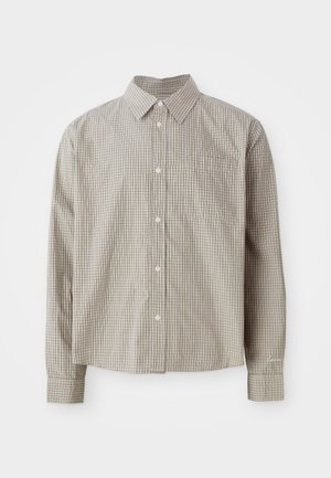 Long-sleeve button-up shirt in a checkbox pattern with beige and brown hues. Features a point collar and single chest pocket. Textured fabric.