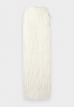 Long white tiered skirt with gathered sections and a drawstring waistband on a light background.