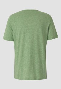 T-shirt à manches courtes de couleur vert clair unie chinée, vue de dos sur un fond neutre.