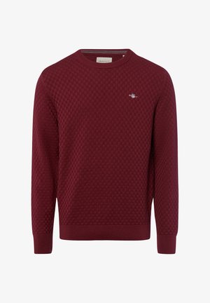 Bordeaux trui met een getextureerd ruitpatroon, ronde halslijn en geribde mouwen en zoom. Klein logo op de borst.