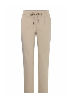Pantalons de jogger beiges en tissu doux, avec une taille élastique dotée d'un cordon de serrage, deux poches avant et une coupe fuselée.