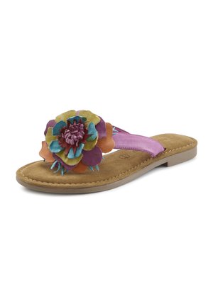 Flat sandal with tan sole, purple strap, and large multicolored layered flower decoration on top.