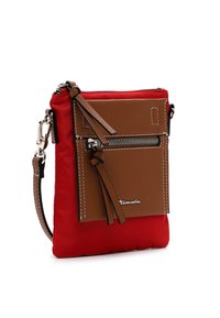 Red quilted nylon bag with a brown leather front pocket, zipper detail, and decorative tassels. Features metal hardware and an adjustable strap.