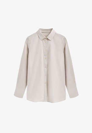 Camisa de botones beige con cuello clásico, mangas largas y corte recto. Hecha de una tela suave con una textura sutil.