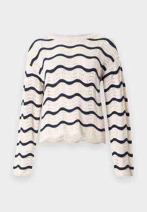 Μπλούζα από πλεκτό κρεμ ύφασμα με μακριά μανίκια και οριζόντιες κυματιστές ναυτικές μπλε ρίγες στο σώμα και τα μανίκια, στρογγυλή λαιμόκοψη και κυματιστό τελείωμα.