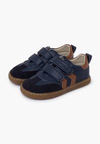Navy blue sneakers with suede and leather materials, featuring double Velcro straps, brown accents, and a textured brown rubber sole.