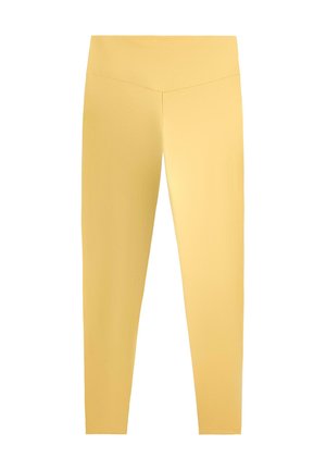 Žute helanke s visokim strukom, glatke teksture i bez vidljivih uzoraka ili logotipa, prikazane na bijeloj pozadini.