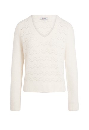 Pull à col V couleur crème avec des manches longues et un motif de tricot en zigzag discret sur le devant et le torse.