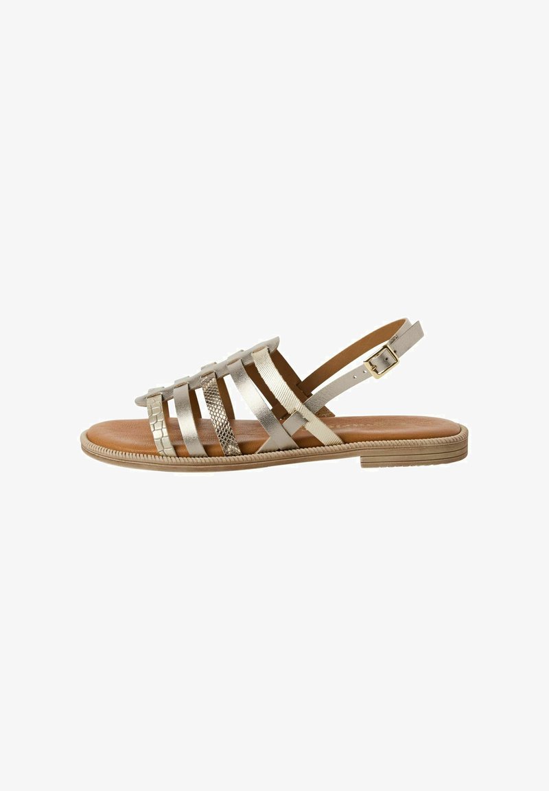 Gold metallic strappy sandals featuring a mix of textures, including smooth and woven patterns, with a tan insole and adjustable ankle strap.