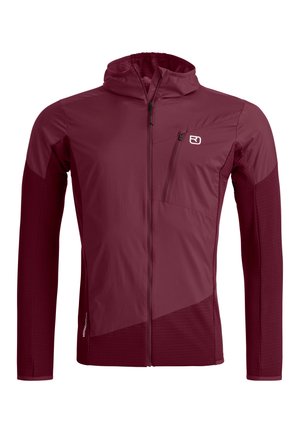 Weinroter Kapuzenanorak mit durchgehendem Reißverschluss vorne, Brusttasche mit Reißverschluss und kontrastierenden Stoffeinsätzen an Ärmeln und unterem Oberkörper.