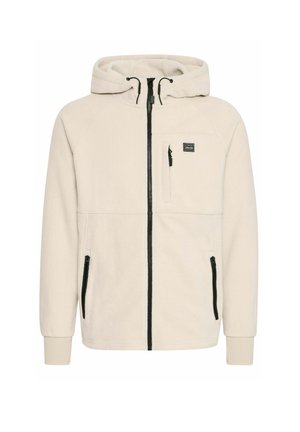 Beige fleece bunda s kapucí, se zapínáním na zip po celé délce, černými detaily, dvěma bočními kapsami a náprsní kapsou se zipem.
