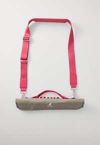 Gray fabric bag with a pink strap, featuring a flat design, handle, and metal hardware. Includes a logo on the front.
