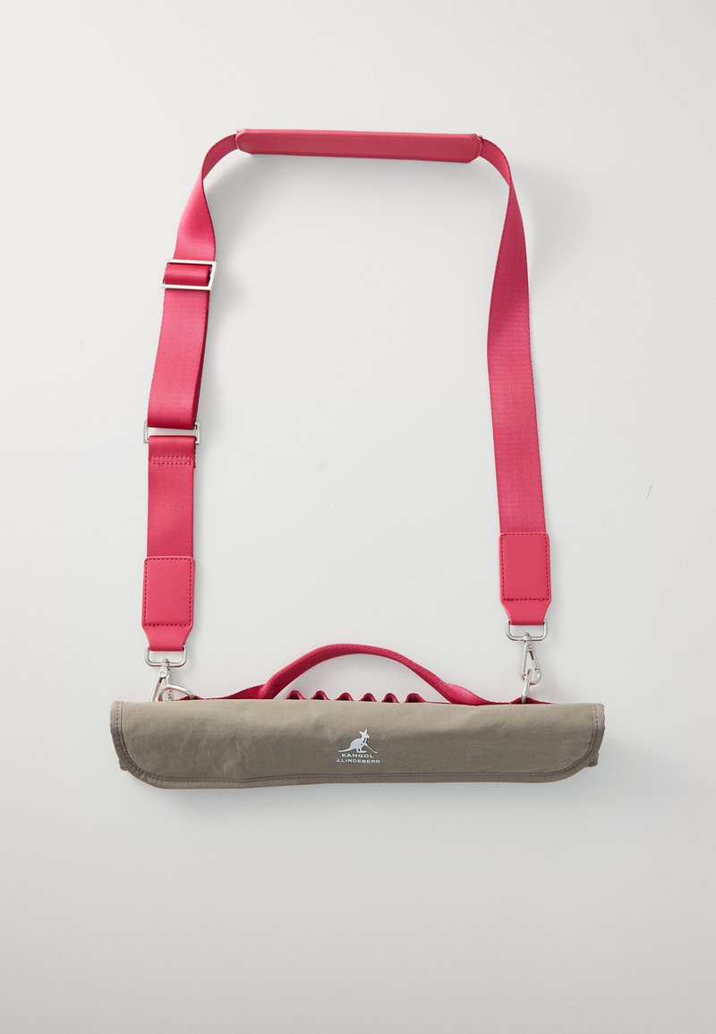 Gray fabric bag with a pink strap, featuring a flat design, handle, and metal hardware. Includes a logo on the front.