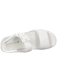 White leather sandal featuring two wide straps, adjustable buckle, and a contoured footbed with a smooth sole. Brand logo is visible.