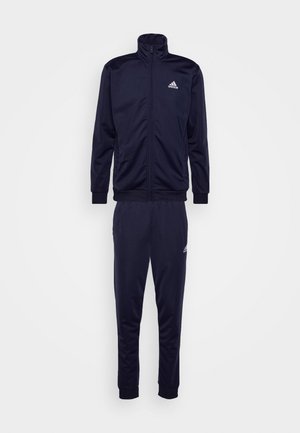 Completo da jogging navy in tessuto liscio; presenta un colletto alto, chiusura con zip e polsini elasticizzati sia sulla giacca che sui pantaloni; logo sul petto.