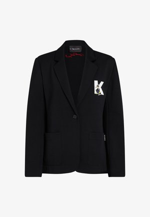 Black blazer made of stretchy fabric, featuring a two-button closure, two front pockets, and a decorative K and character patch.