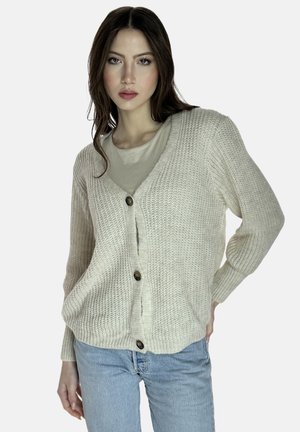 Gebreid vest in lichtbeige met een V-hals, lange mouwen en drie knopen aan de voorkant. Textuur op het oppervlak en een losse pasvorm.