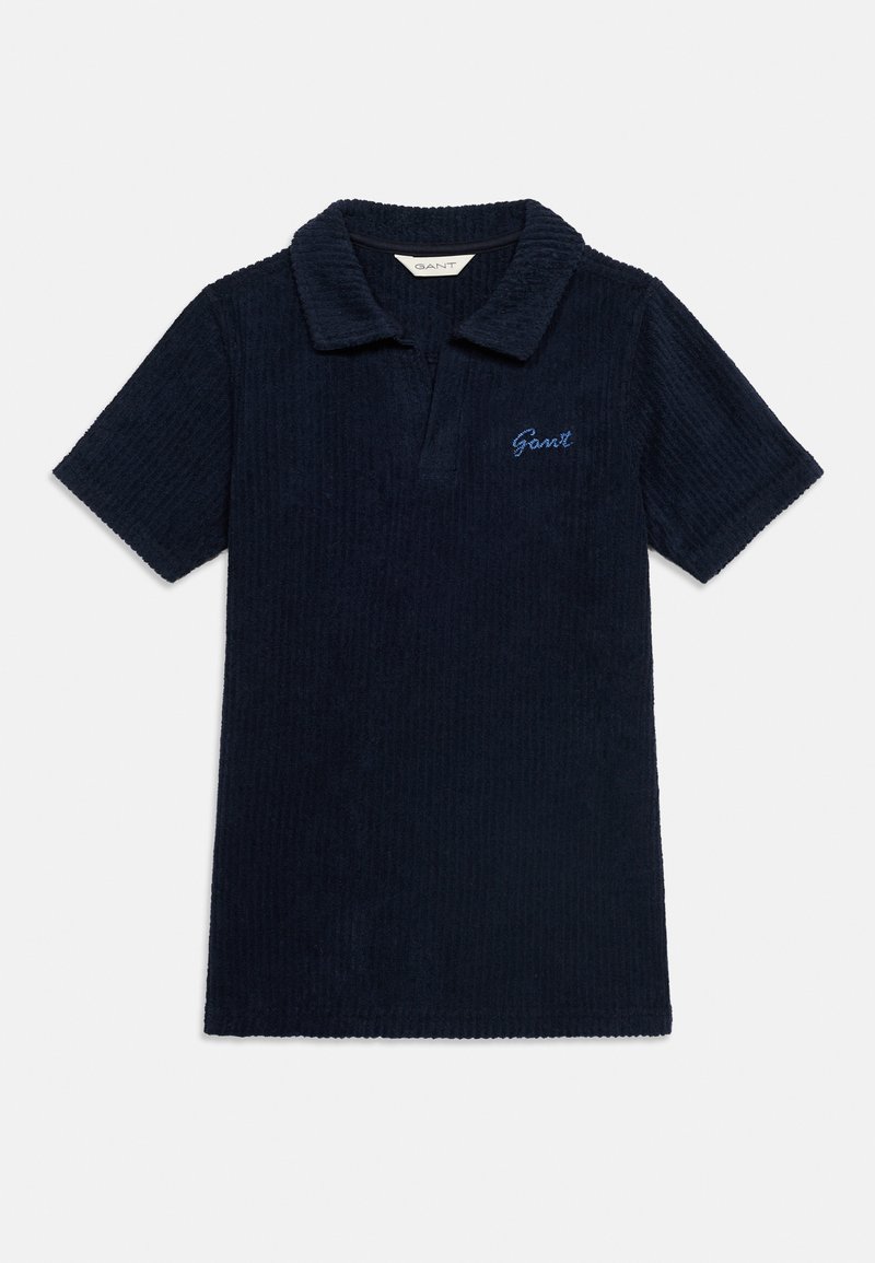 Polo bleu marine à manches courtes texturé avec col souple et petit logo "Gant" brodé sur la poitrine gauche.