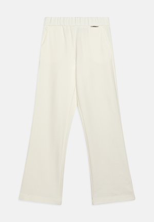 Pantaloni a gamba larga di colore crema realizzati in tessuto morbido, con vita elasticizzata e due tasche laterali. Design semplice senza motivi visibili.
