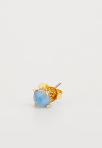 Gold stud earring featuring a round, light blue gemstone with faceted surface, surrounded by small clear stones and a secure backing.