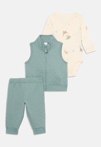 Pukki vihreä kiiltävä vauvan liivi ja housut -sarja, jossa on kermaisenvalkoinen pitkähihainen bodysuit, jossa on pieniä dinosaurustulosteita.