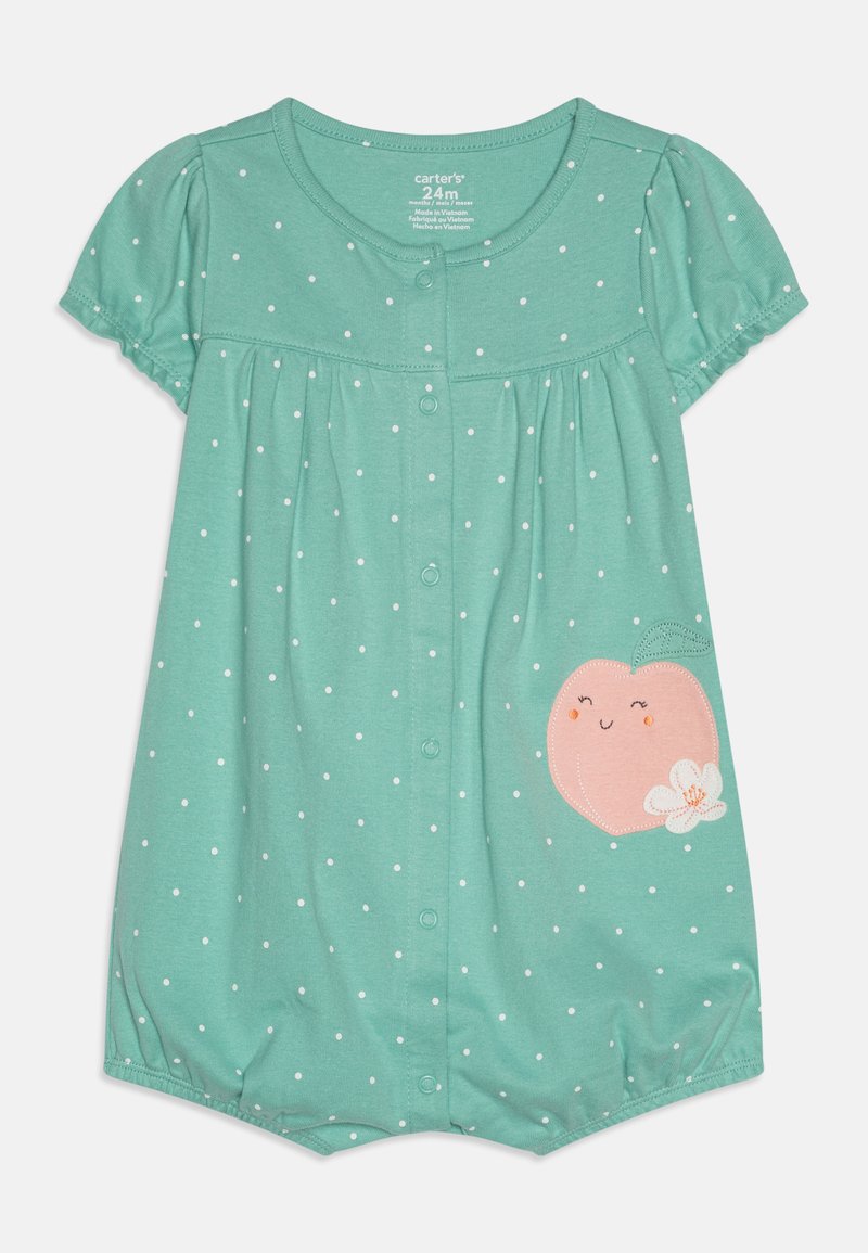 Lyse teal kortærmet bodystocking med hvide prikker, prydet med en fersken grafik med et smil og en blomst. Trykknapper gør påklædning nemt.