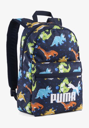 Marineblauer Puma-Rucksack mit bunten Dinosauriermustern in Orange, Grün, Blau und Gelb, mit vorderer Reißverschlusstasche und gepolsterten Schulterriemen.