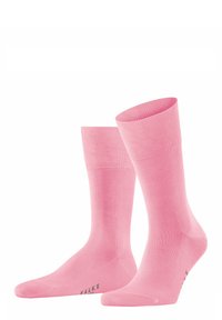 Calzini alla caviglia rosa con una texture liscia, bordo a coste e punta rinforzata. Presentano un marchio discreto in grigio sulla suola.