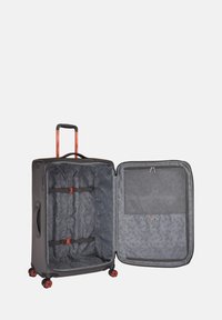 Valigia grigia con manico arancione, aperta per rivelare un interno a motivo. Presenta cinghie regolabili, una tasca in rete e quattro ruote rosse per la mobilità.