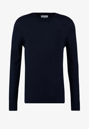 Suéter de manga longa azul marinho feito de um tecido suave. Apresenta um decote redondo, punhos canelados e um corte ajustado. Design minimalista sem padrões.