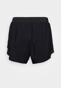 Svarta träningsshorts med elastisk midja och sidopaneler i mesh, visade bakifrån mot en ljus enhetlig bakgrund.