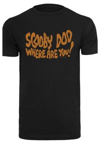 Černé bavlněné tričko s výrazným oranžovým textem "SCOOBY DOO, KDE JSI!" v hravém, nepravidelném písmu.