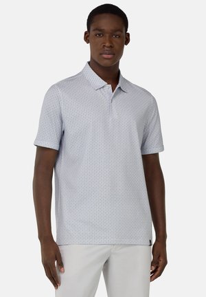 Light blue short-sleeve polo shirt with a geometric pattern, collared neckline, and a single button. Soft fabric, straight cut.