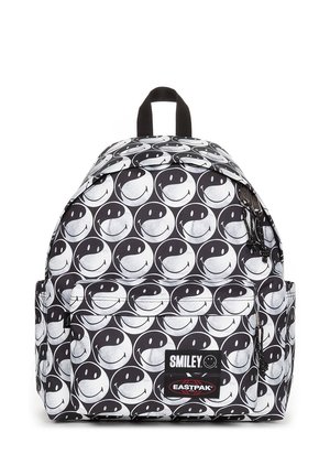 Zaino in bianco e nero con un motivo a faccine sorridenti ripetuto, realizzato in tessuto con una texture resistente. Tasca accessorio con cerniera.