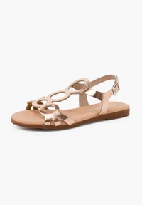Bronzefarbene metallische Sandalen mit runden Ausschnitten, flacher Sohle, verstellbarem Knöchelriemchen und glatter Textur im minimalistischen Design.